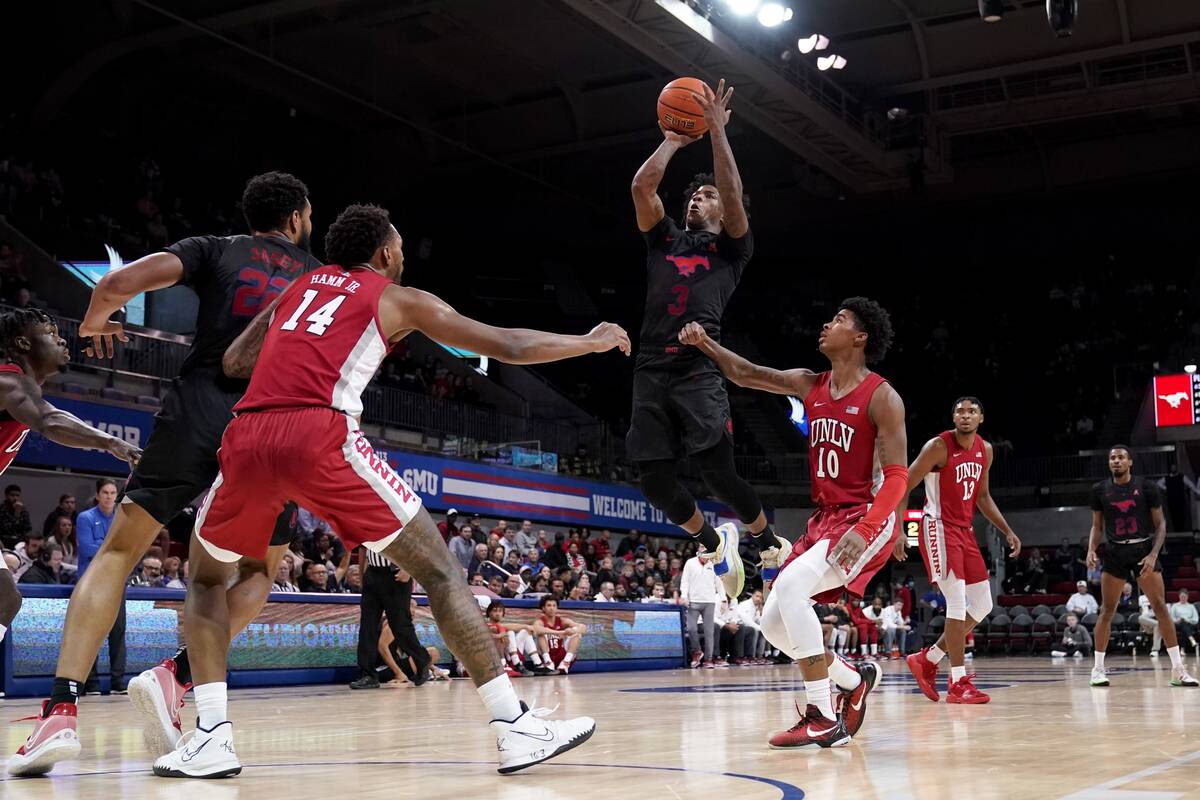 SMU guard Kendric Davis (3) takes a shot between UNLV 's Royce Hamm Jr. (14) and Keshon Gilbert ...