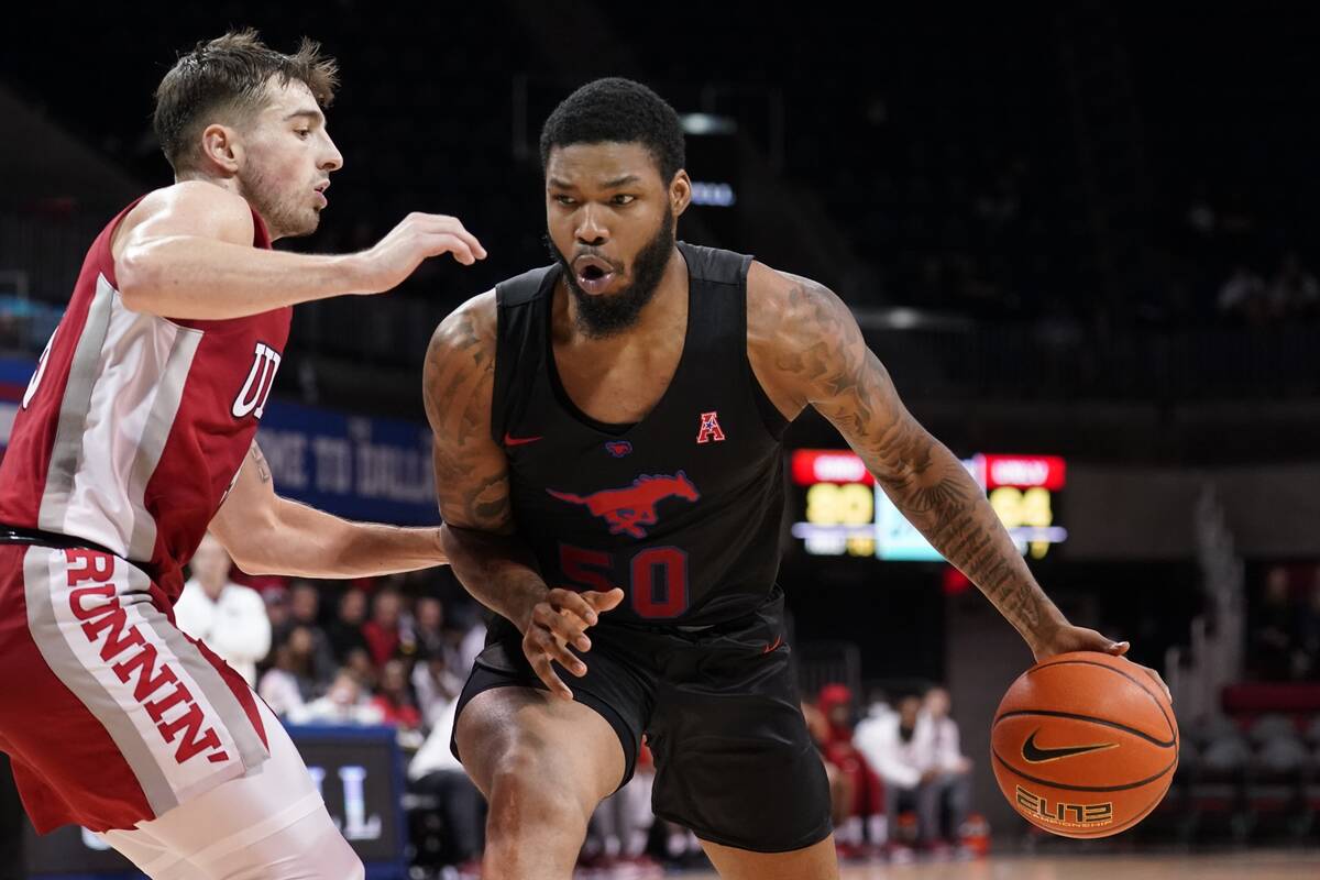 UNLV guard Jordan McCabe, left, defends as SMU forward Marcus Weathers (50) works to take a sho ...