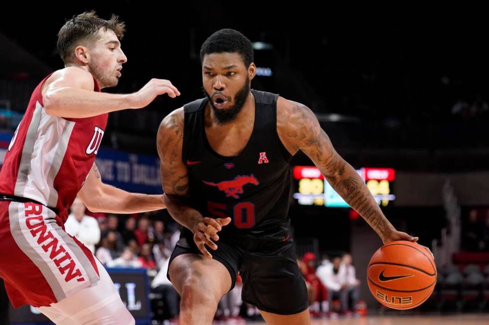 UNLV guard Jordan McCabe, left, defends as SMU forward Marcus Weathers (50) works to take a sho ...