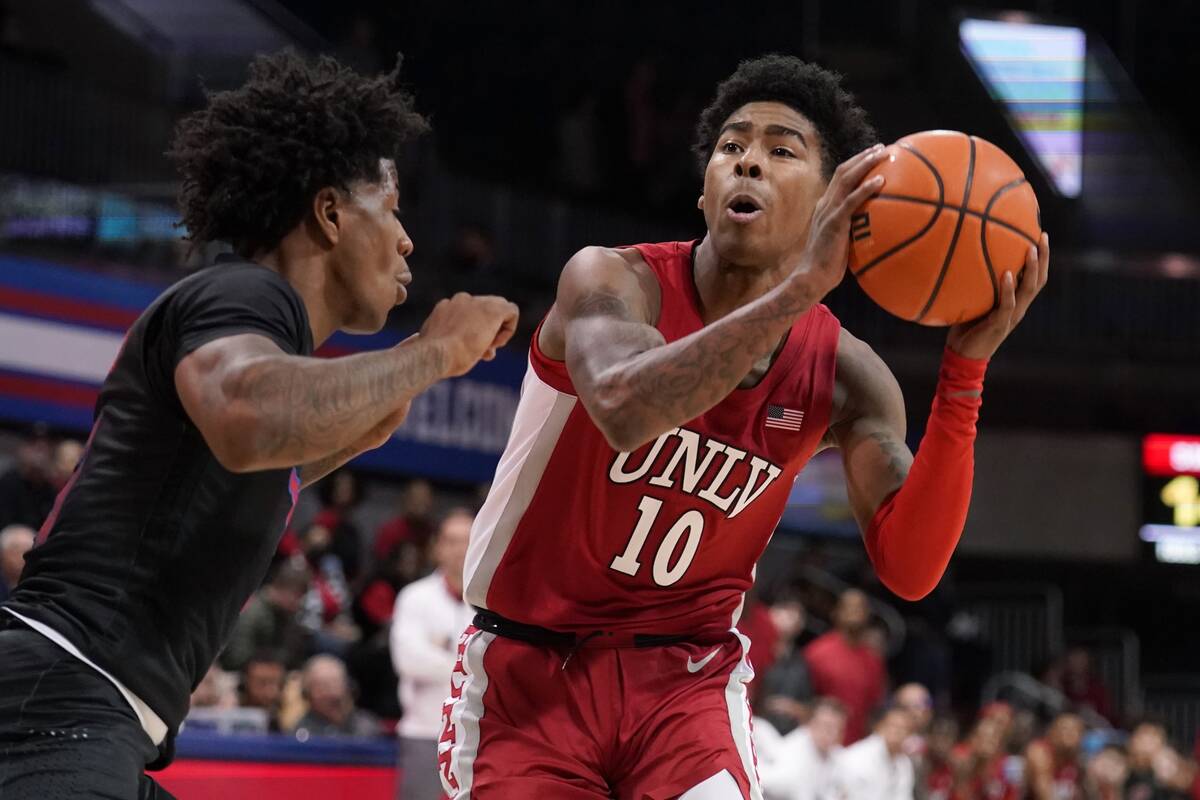 SMU guard Kendric Davis, left, defends as UNLV guard Keshon Gilbert (10) positions for a shot i ...