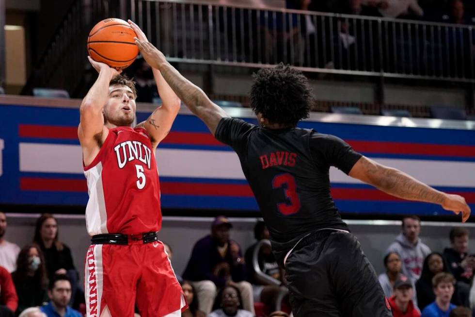 UNLV guard Jordan McCabe (5) takes a shot as SMU guard Kendric Davis (3) defends in the first h ...