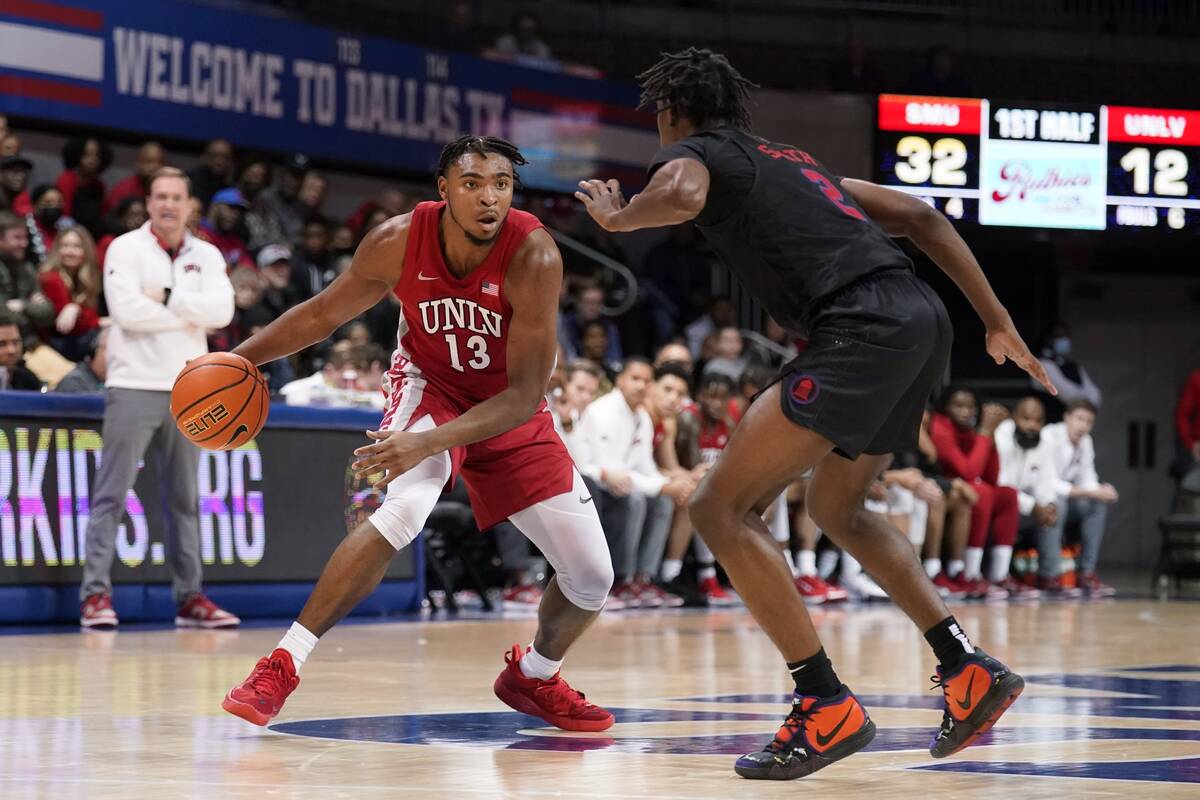 UNLV guard Bryce Hamilton (13) works for an opening to the basket against SMU guard Jalen Smith ...