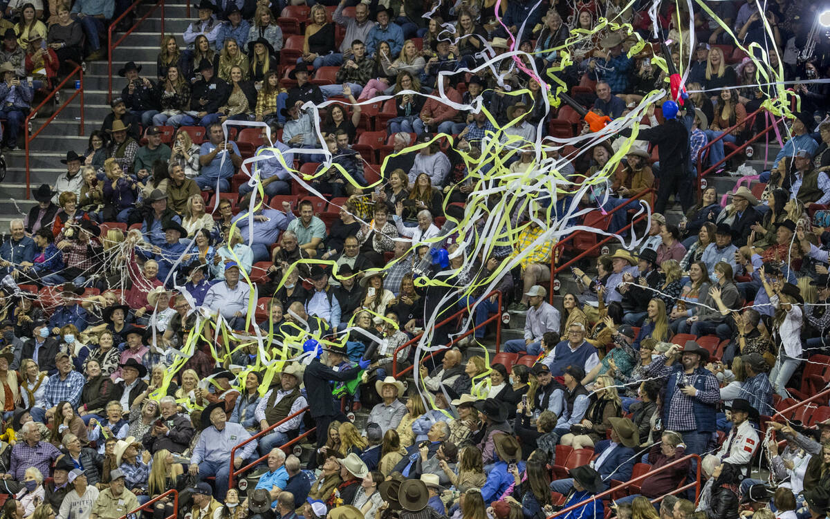 Fans are showered with confetti by the Blue Man Group during the opening night of Wrangler Nati ...