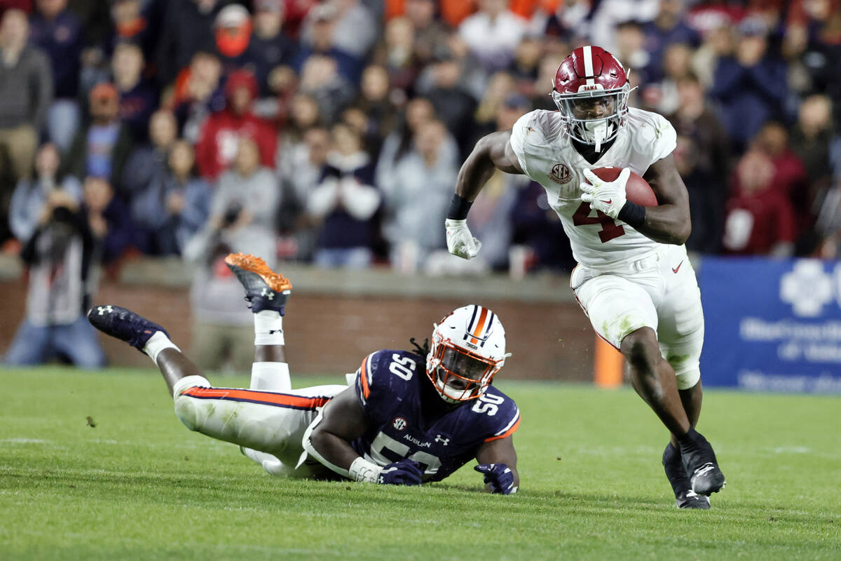 Alabama running back Brian Robinson Jr. (4) carries the ball against Auburn during the second h ...