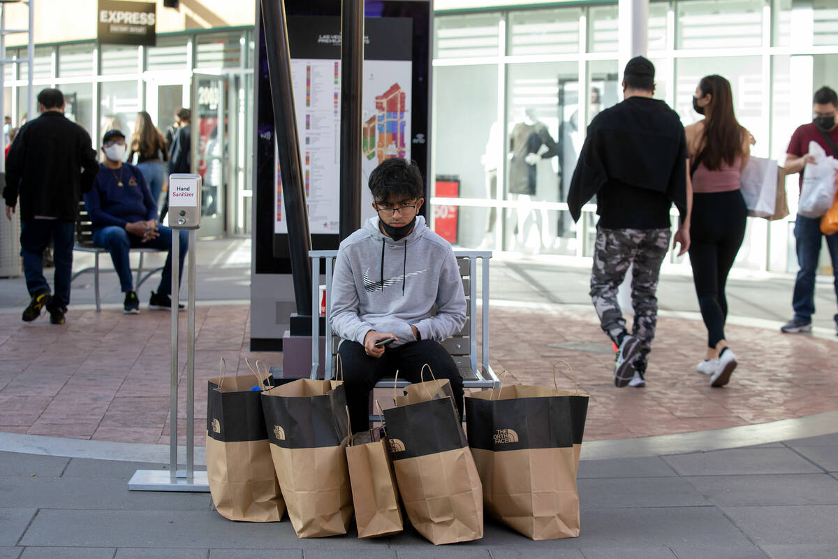 Jary Shahab, of Chicago, takes a break while his family shops for Black Friday at the Las Vegas ...
