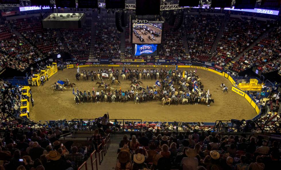 Competitors gather in the arena as the fans applaud at the start of the opening night of Wrangl ...