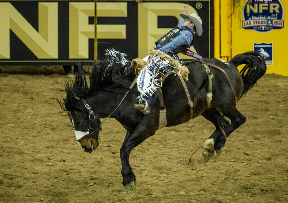 Chase Brooks of Deer Lodge, MT., rides Marquee during his Saddle Bronc Riding tie for first pla ...