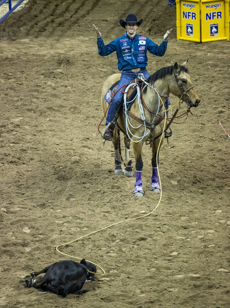 Shane Hanchey of Sulphur, LA., celebrates his win in Tie-Down Roping during the opening night o ...