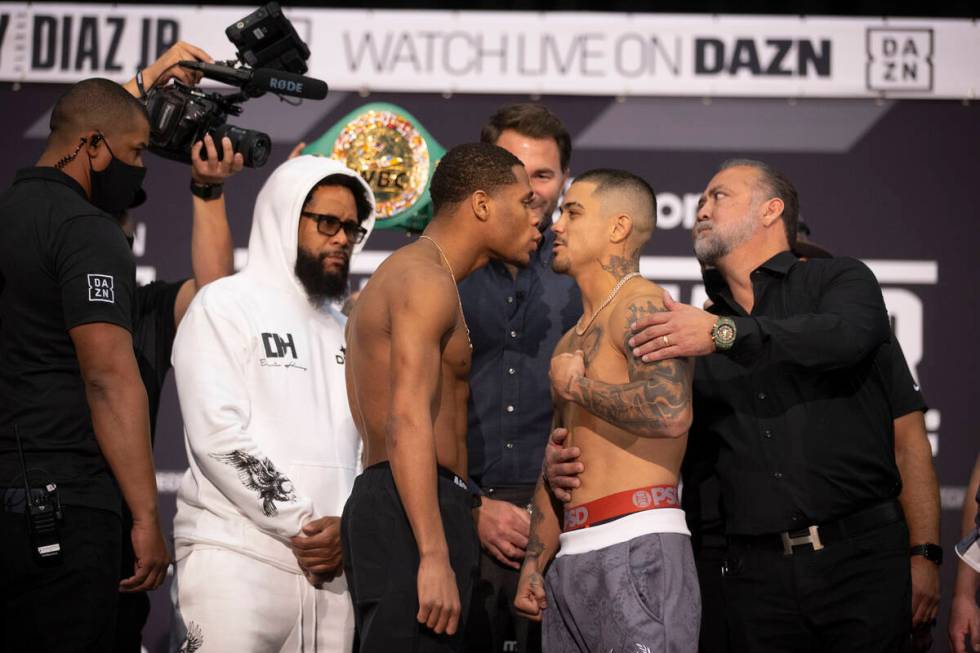 Devin Haney, left, and Joseph Diaz Jr. face off during a weigh-in event at the MGM Grand Garden ...