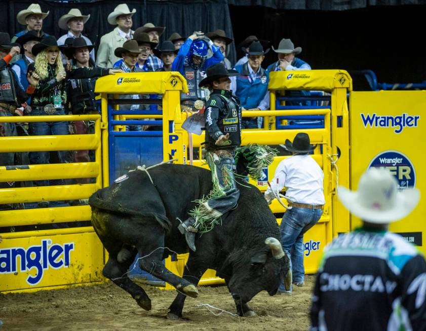 J.B. Mauney of Cotulla, Texas, rides Johnny Thunder in Bull Riding during the Day 2 of the Wran ...