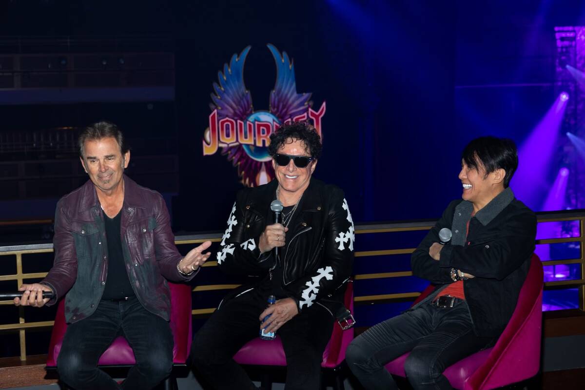 Members of the superstar rock band Journey, from left, Jonathan Cain, Neal Schon and Arnel Pine ...