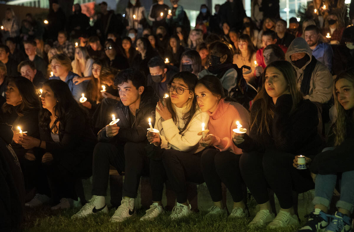 People attend a vigil at UNLV on Saturday night for Nathan Valencia, a 20-year-old student who ...