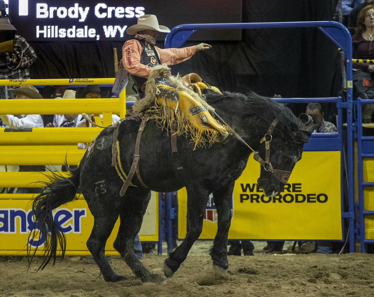 Brody Cress of Hillsdale, WY., rides Kitty Whistle in Saddle Bronc Riding for first place durin ...