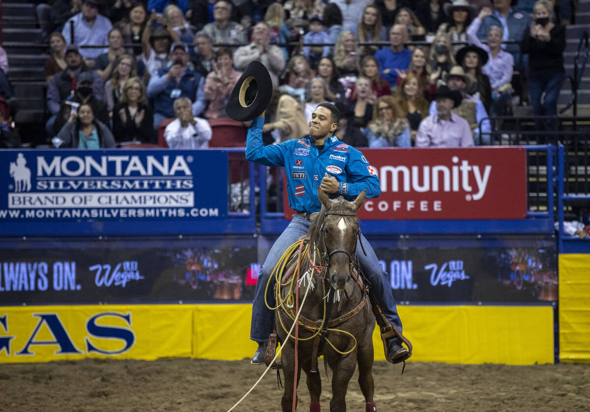 Shad Mayfield of Clovis, N.M., celebrates his first place win in Tie-Down Roping during the Da ...