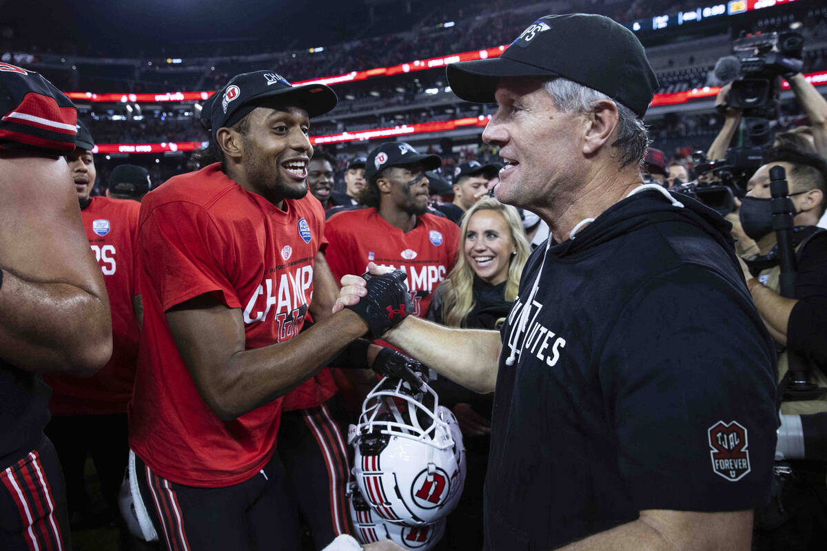 Utah Utes head coach Kyle Whittingham celebrates with his players after beating Oregon Ducks 3 ...