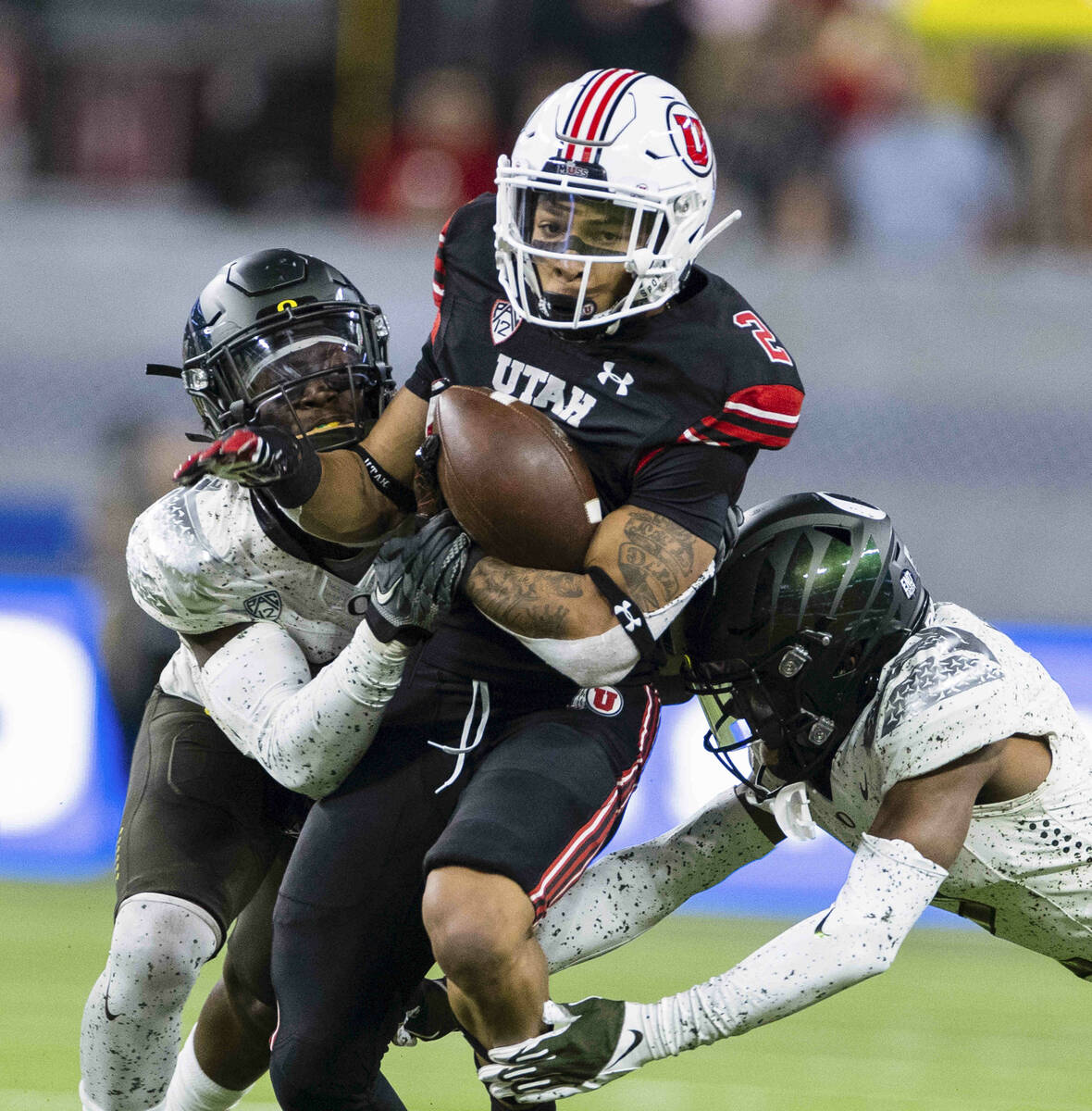 Utah Utes running back Micah Bernard (2) breaks through Oregon Ducks defenders during the seco ...