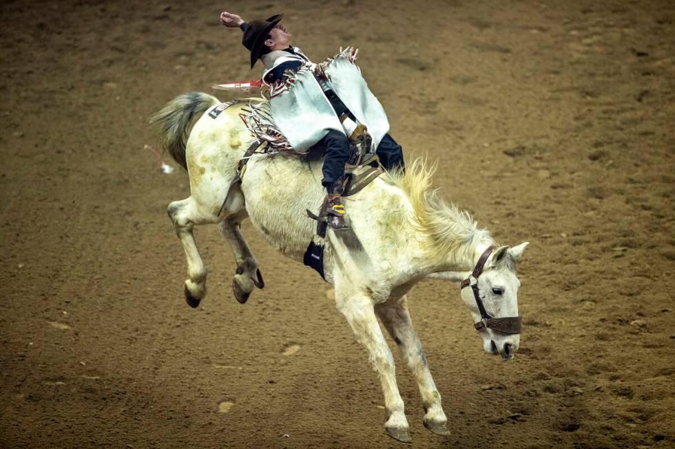 Cole Franks of Clarendon, Texas, rides Deep Springs for first place in Bareback Riding during t ...