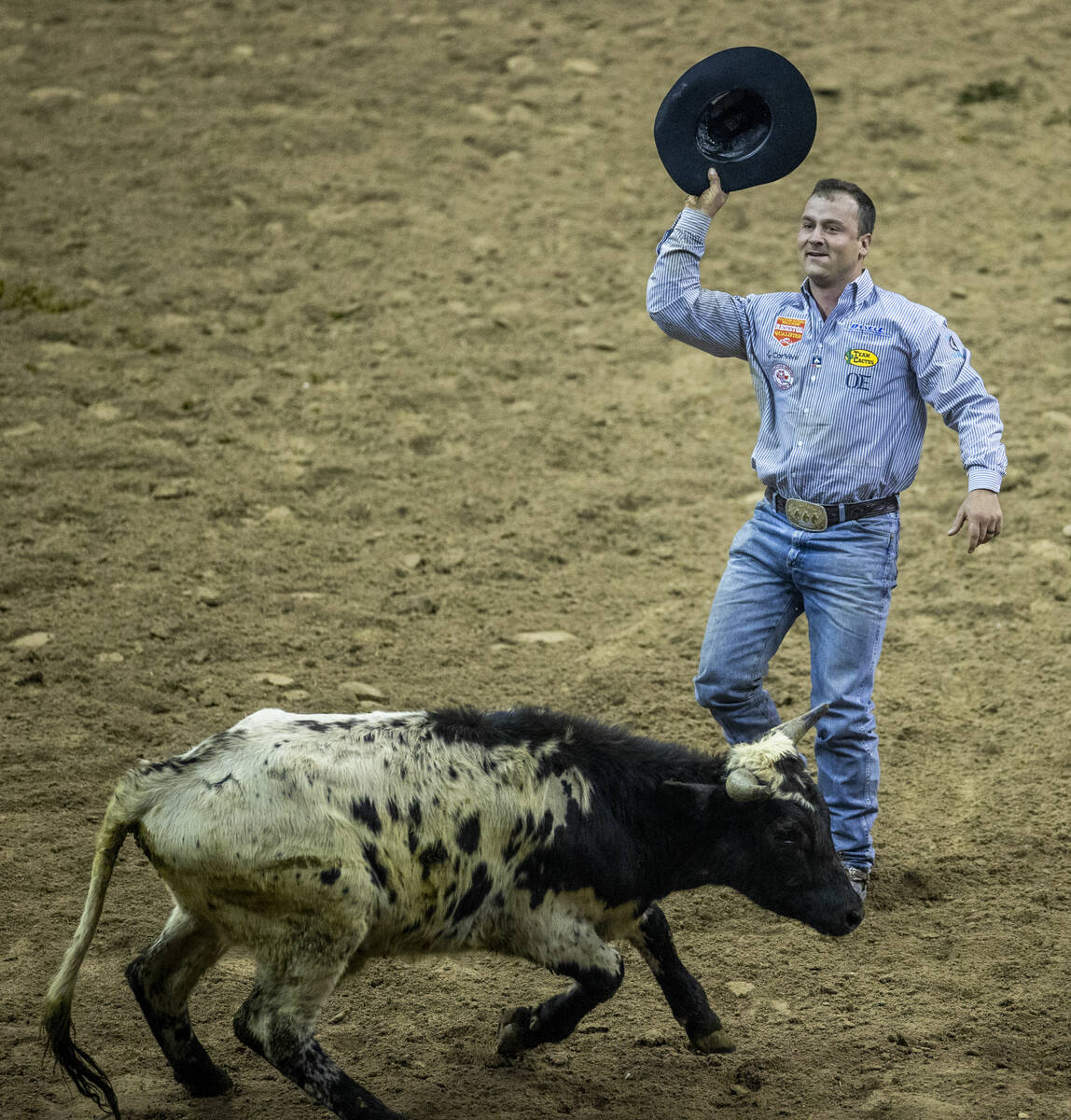 Tristan Martin of Sulphur, Louisiana, is pleased after downing his animal in Steer Wrestling fo ...