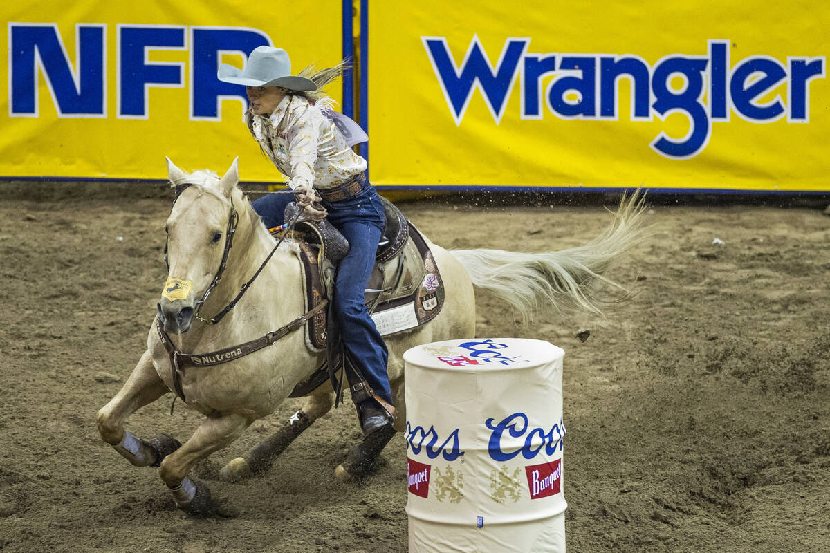 Stevi Hillman of Weatherford, Texas, navigates around the obstacles for first place in Barrel R ...