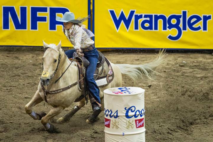 Stevi Hillman of Weatherford, Texas, navigates around the obstacles for first place in Barrel R ...
