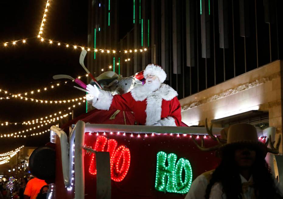 Santa waves during a holiday parade at Downtown Summerlin, Friday, Dec. 3, 2021, in Las Vegas. ...