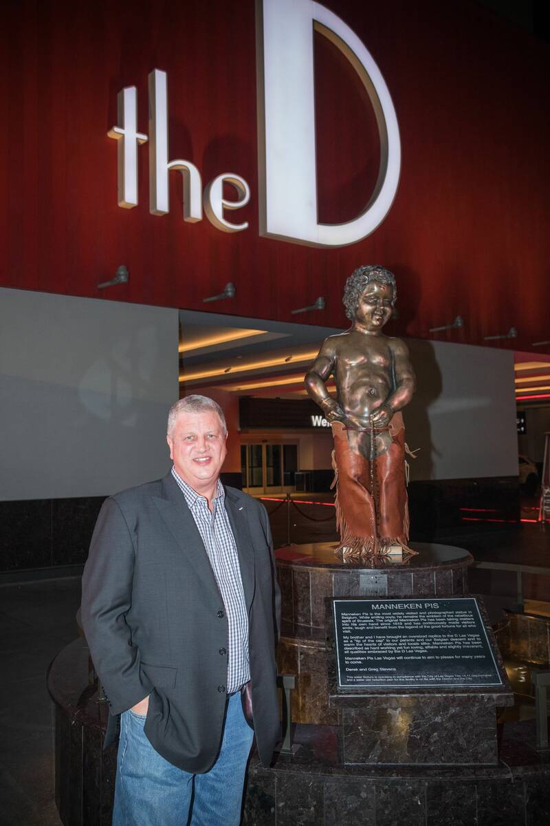 Derek Stevens, left, is shown next to the famed Manneken Pis statue at the D Las Vegas on Thurs ...