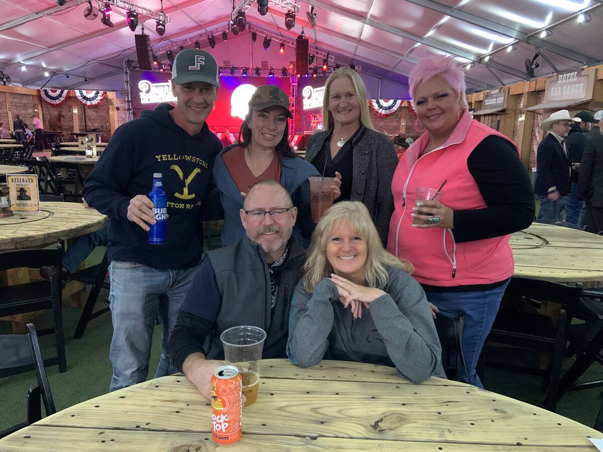 A group of Minnesotans gets prepped for Friday night's Wrangler NFR viewing party at the Downto ...