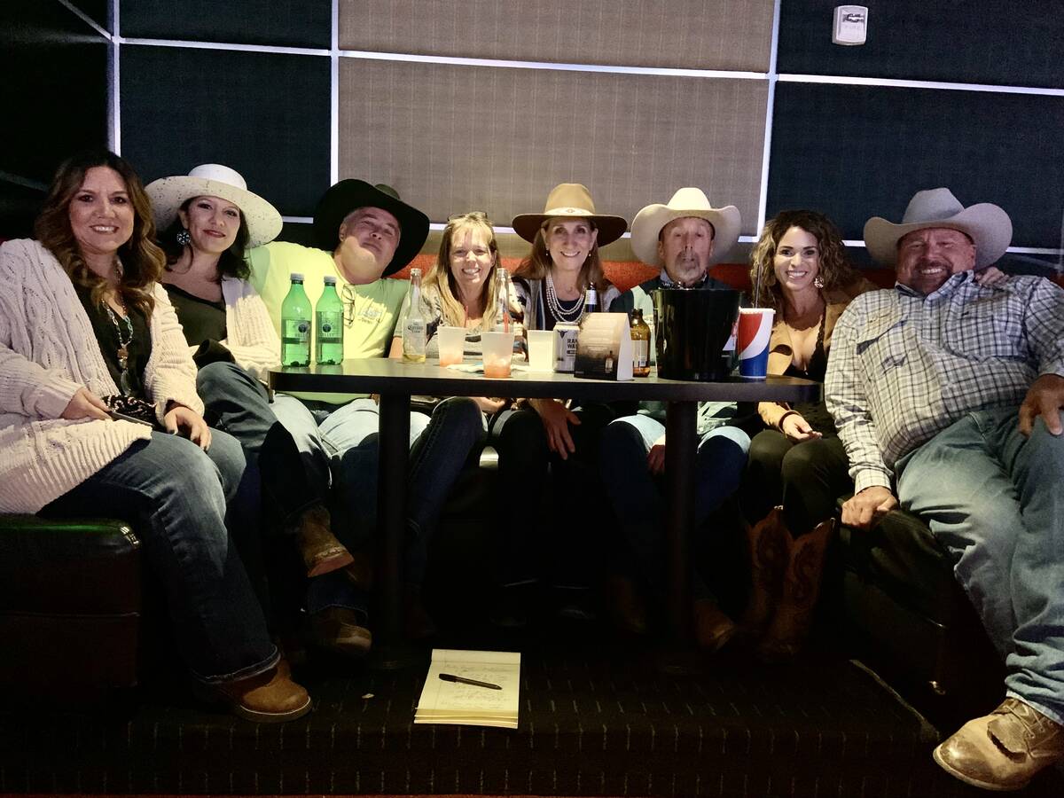 Rodeo fans from California squeezed into a booth at the South Point Showroom for Friday night's ...