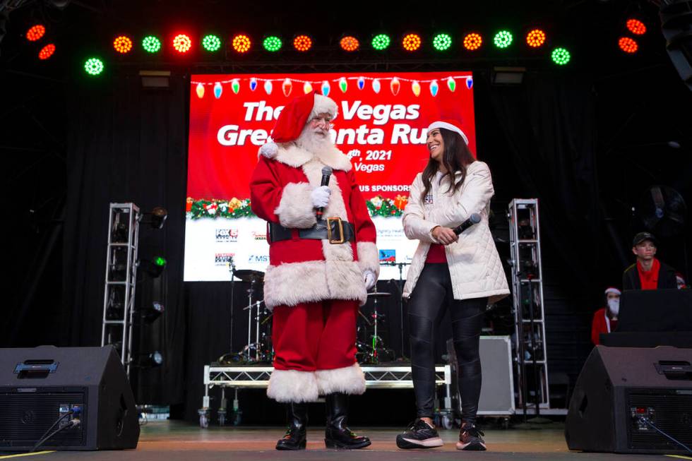 Santa makes an appearance at the pre-race festivities at Fremont Street Experience alongside ev ...