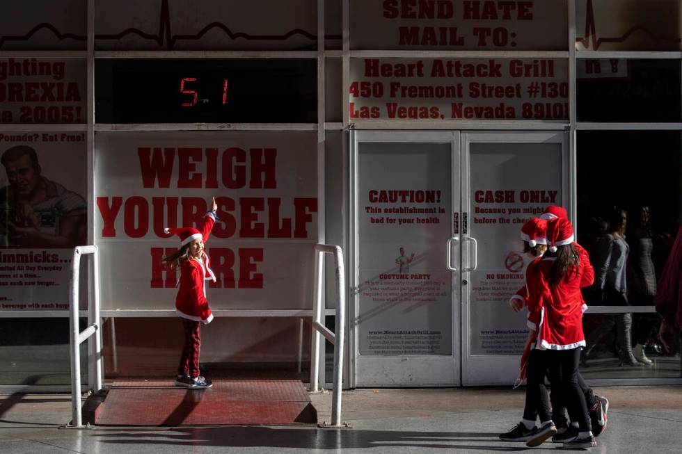 Lainee Villaneuva, 8, weighs in at 51 pounds outside the Heart Attack Grill during The Las Vega ...