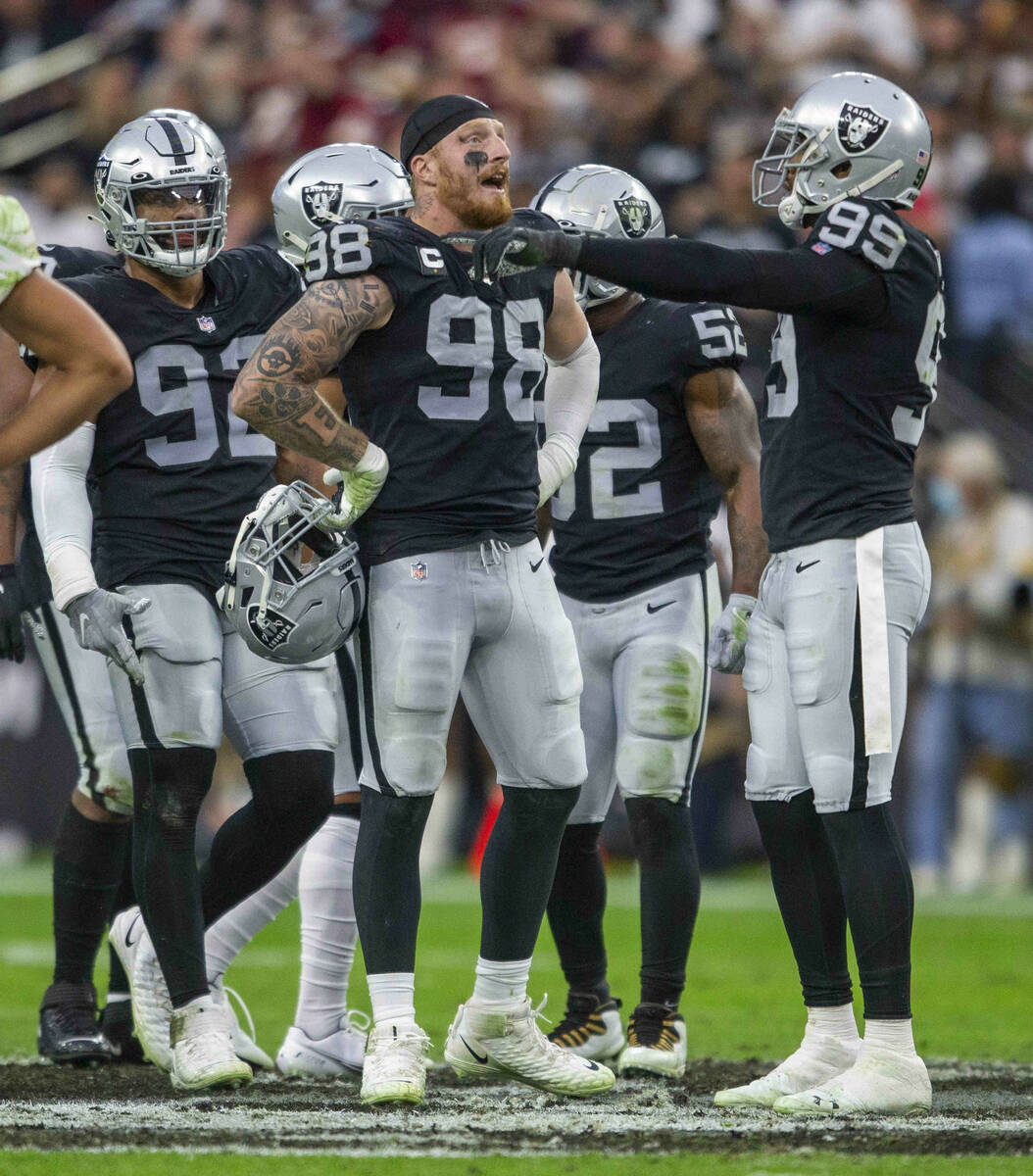 Raiders defensive end Maxx Crosby (98) reacts to being penalized for roughing Washington Footba ...