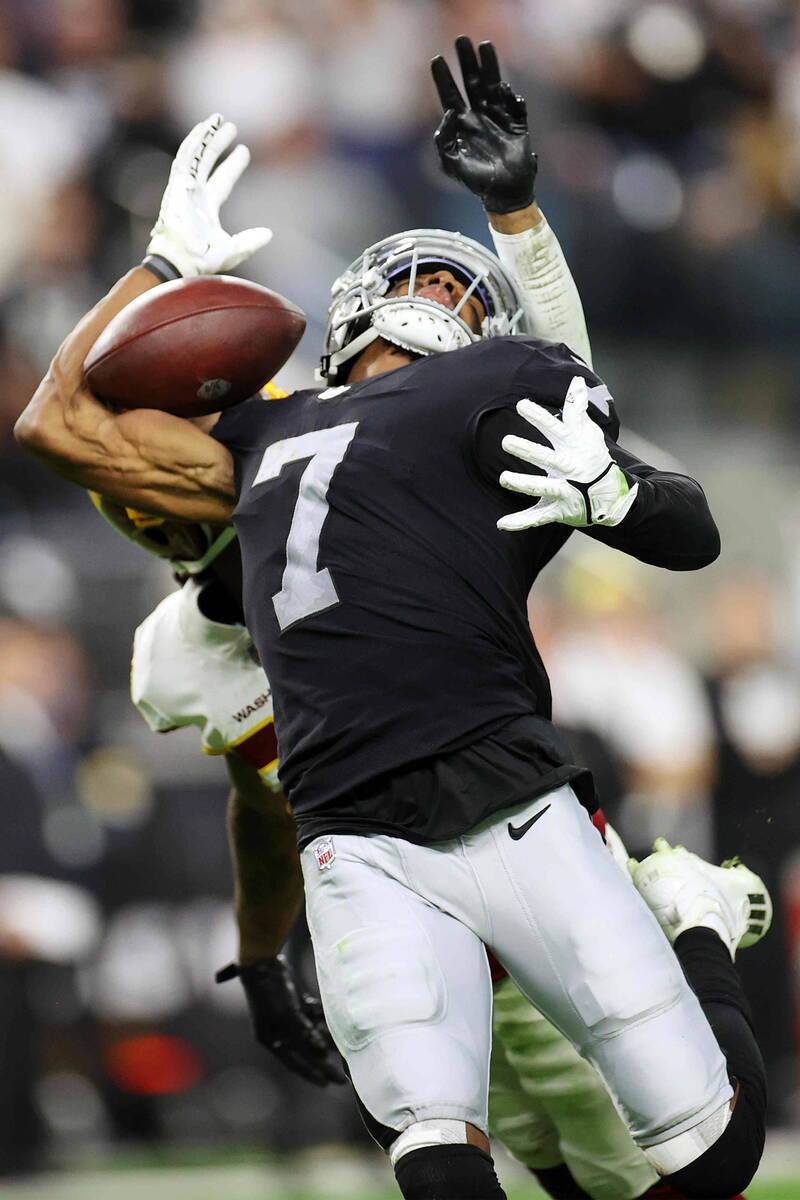 Raiders wide receiver Zay Jones (7) misses the ball under pressure from Washington Football Tea ...