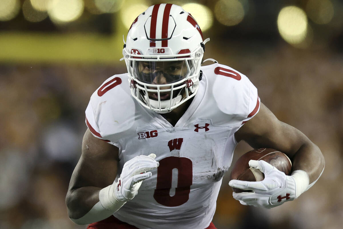 Wisconsin running back Braelon Allen (0) carries the ball during the second half of an NCAA col ...