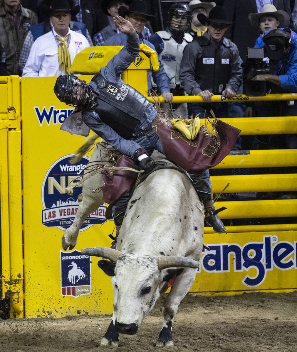 Dustin Boquet of Bourg, La., rides Hous Bad News in Bull Riding during the fourth round of the ...