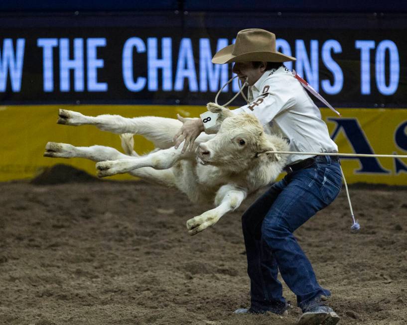 Ty Harris of San Angelo, Texas, in Tie-Down Roping during the fourth round of the Wrangler Nati ...