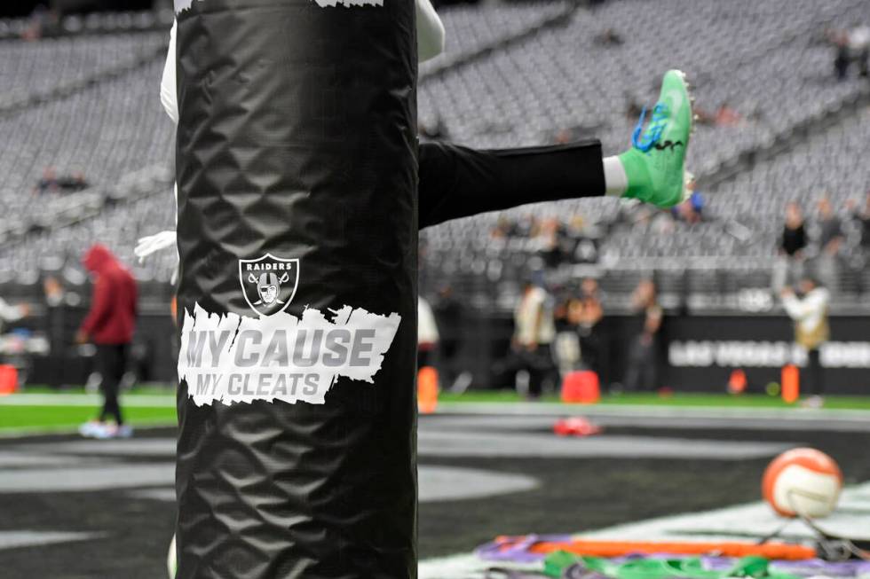 A My Cause My Cleats sign before an NFL football game between the Las Vegas Raiders and the Was ...