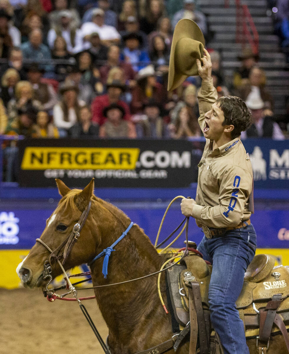 Ty Harris of San Angelo, Texas, celebrates his first place time of 7.10 seconds in Tie-Down Rop ...