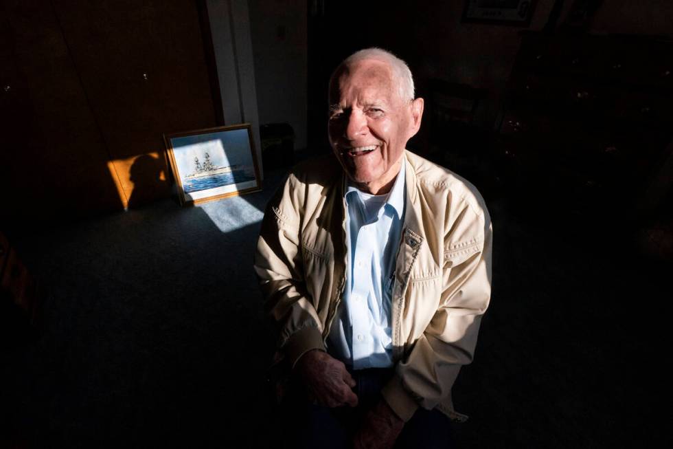Pearl Harbor survivor and World War II Navy veteran David Russell, 101, poses for a photo along ...