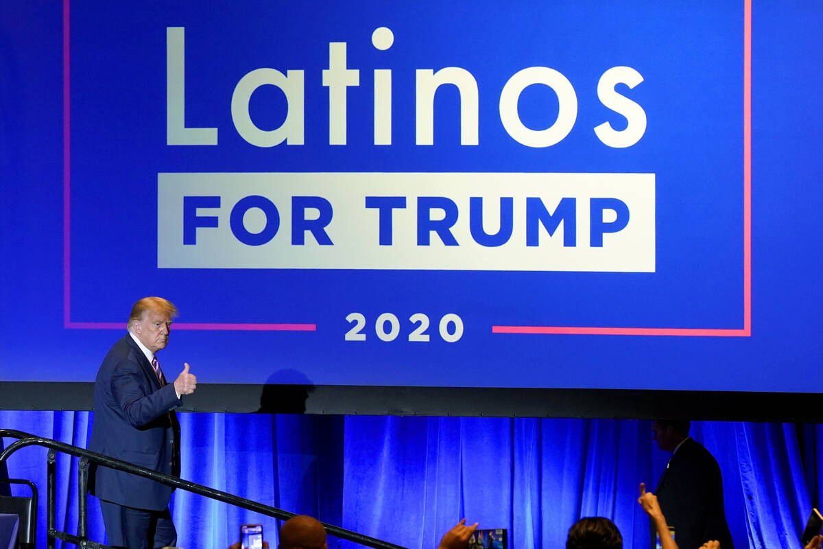 President Donald Trump give a thumbs up to the cheering crowd after a Latinos for Trump Coaliti ...