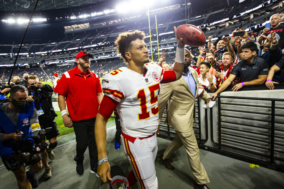 Kansas City Chiefs quarterback Patrick Mahomes (15) walks by the Wynn Field Club after defeatin ...