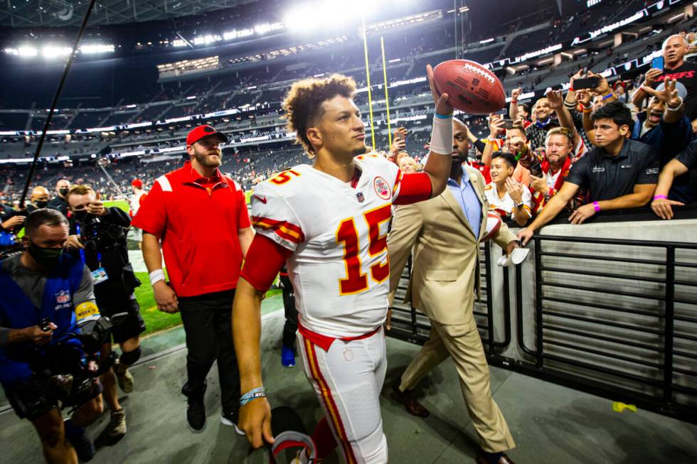 Kansas City Chiefs quarterback Patrick Mahomes (15) walks by the Wynn Field Club after defeatin ...