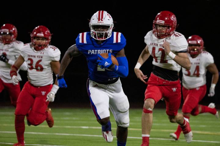 Liberty High wide receiver Germie Bernard (2) breaks through Arbor View defense during a playof ...