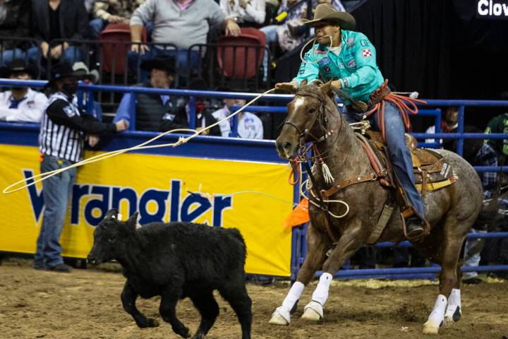 Shad Mayfield of Clovis, N.M., eyes his animal in Tie-Down Roping during the sixth round of the ...