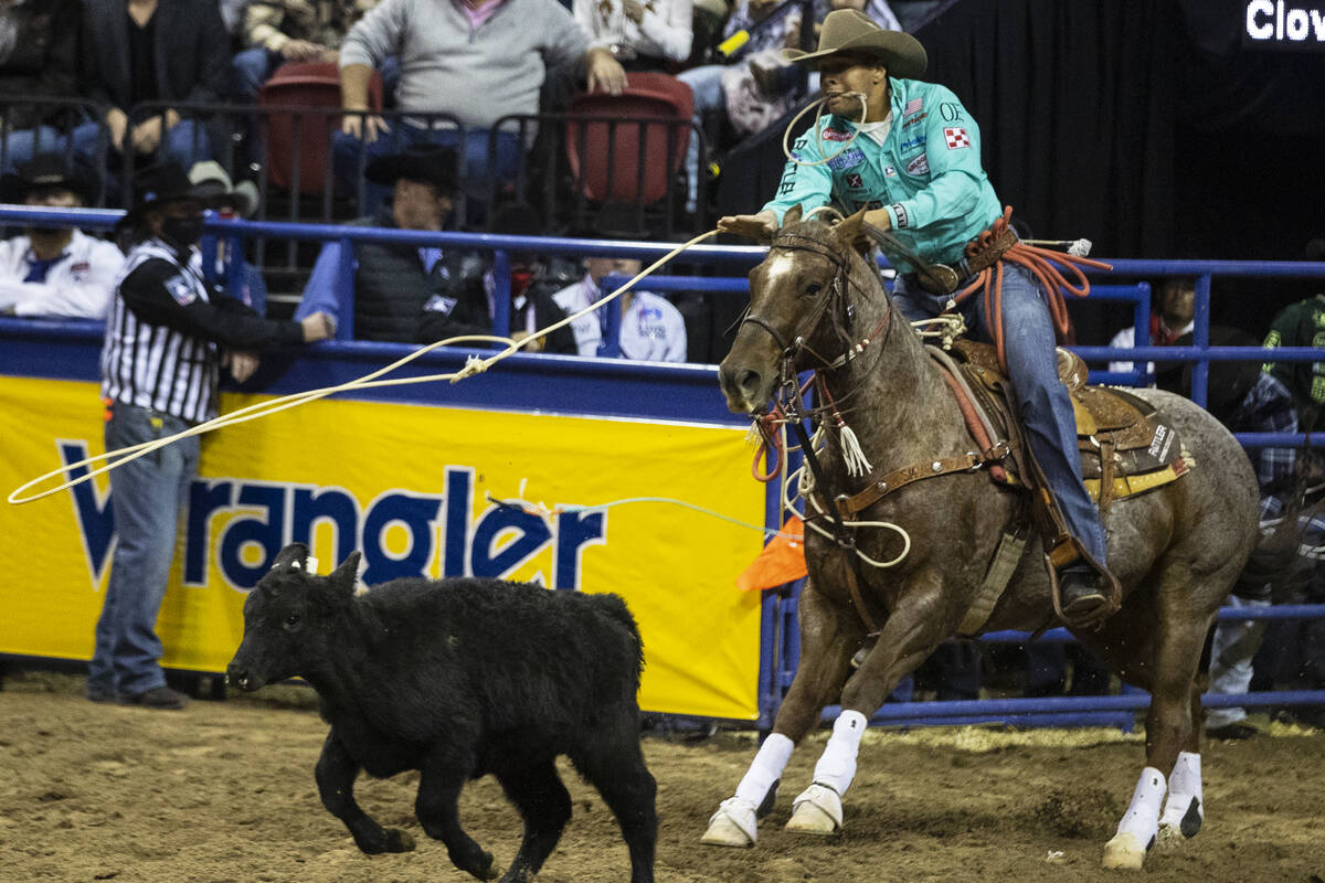 Shad Mayfield of Clovis, N.M., eyes his animal in Tie-Down Roping during the sixth round of the ...