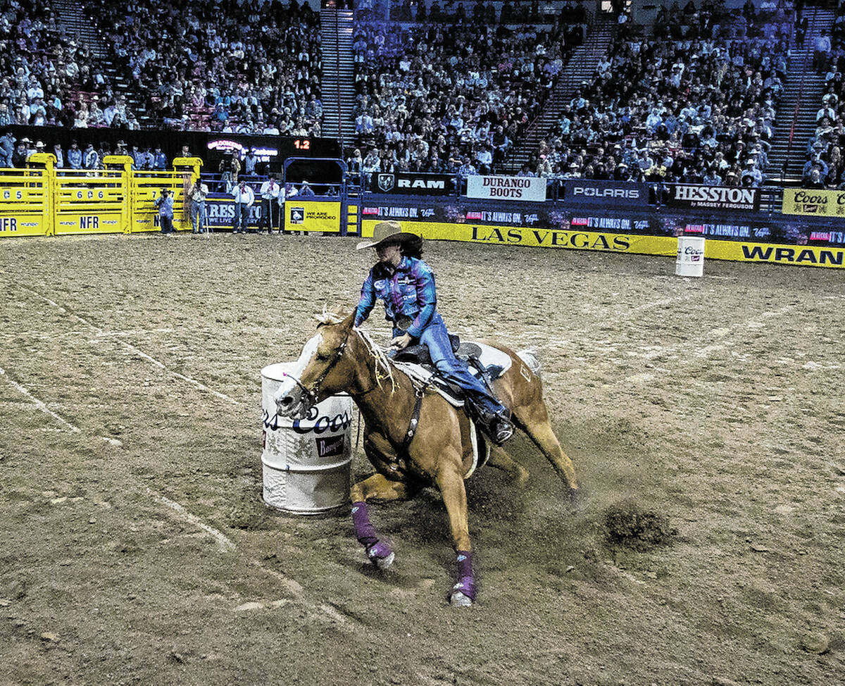 Ivy Saebens of Nowata, Okla., competes in Barrel Racing during the sixth round of the Wrangler ...