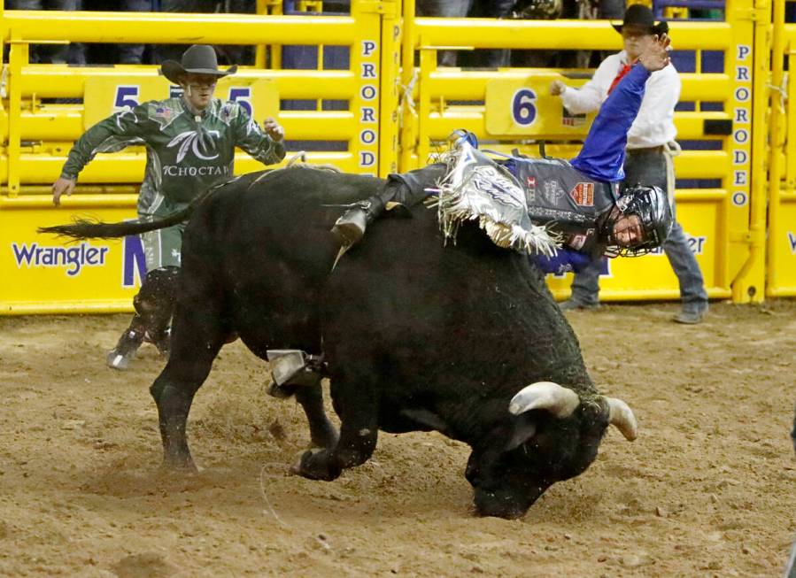 Stetson Dell Wright of Milford, Utah competes in the bull riding event during the seventh go-ro ...
