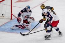 Golden Knights right wing Reilly Smith (19) scores on Columbus Blue Jackets goaltender Elvis Me ...