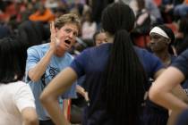 Centennial head coach Karen Weitz tries to fire up her team in the second quarter during a time ...