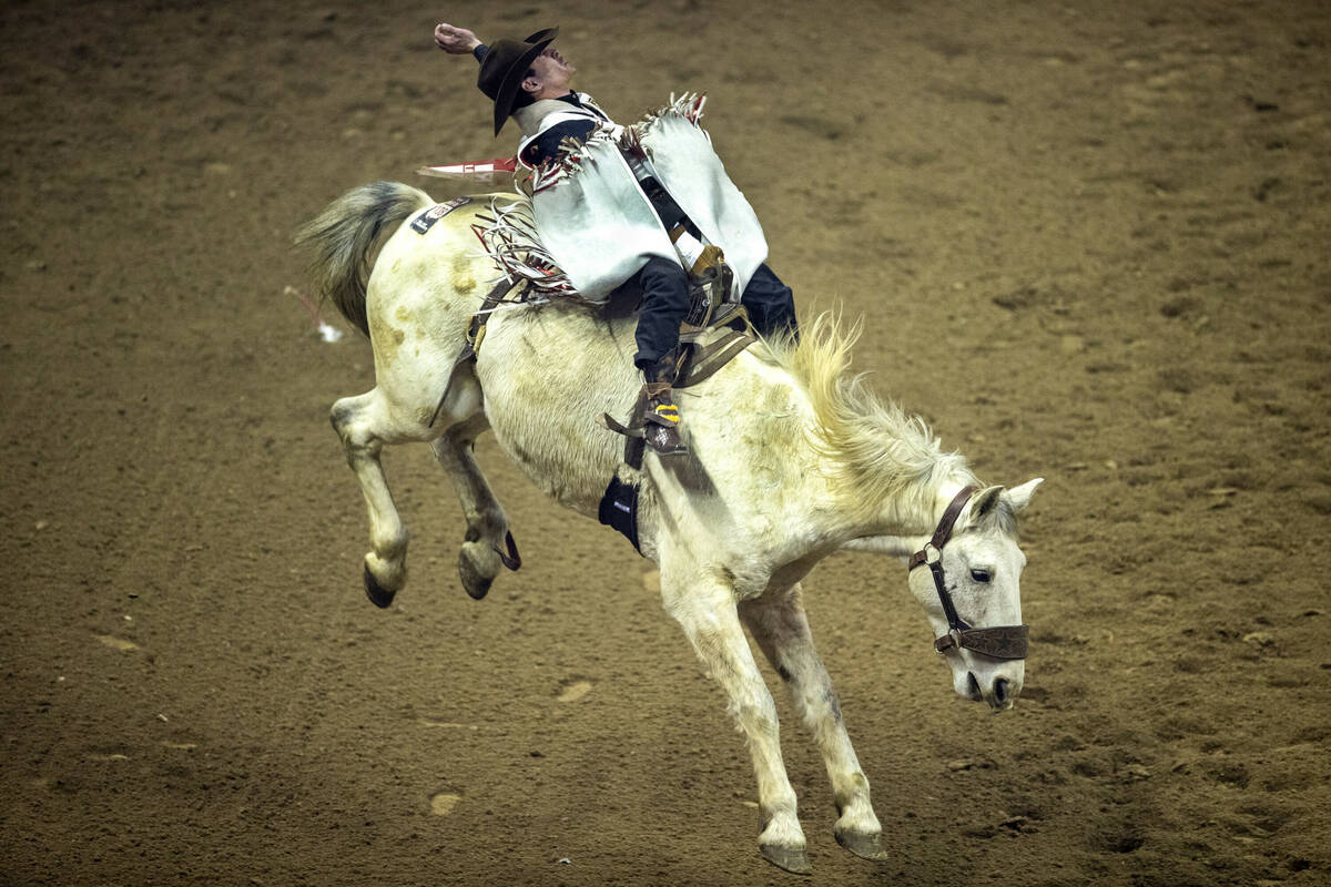 Cole Franks of Clarendon, TX., rides Deep Springs for first place in Bareback Riding during the ...
