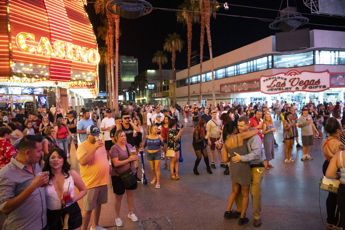 People visit the Fremont Street Experience in Las Vegas, Friday, July 2, 2021. (Erik Verduzco / ...